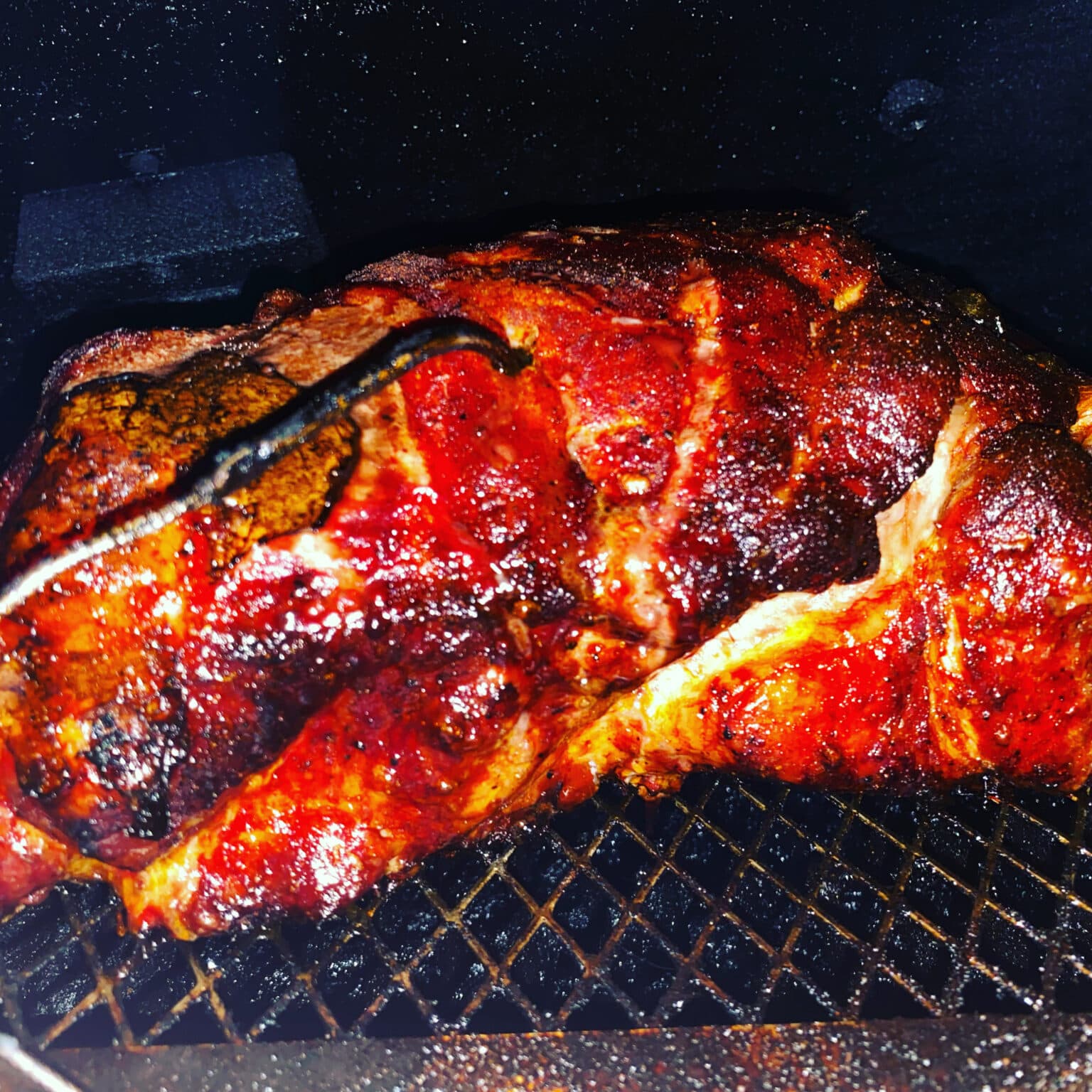 closeup of barbecued pork on the grill