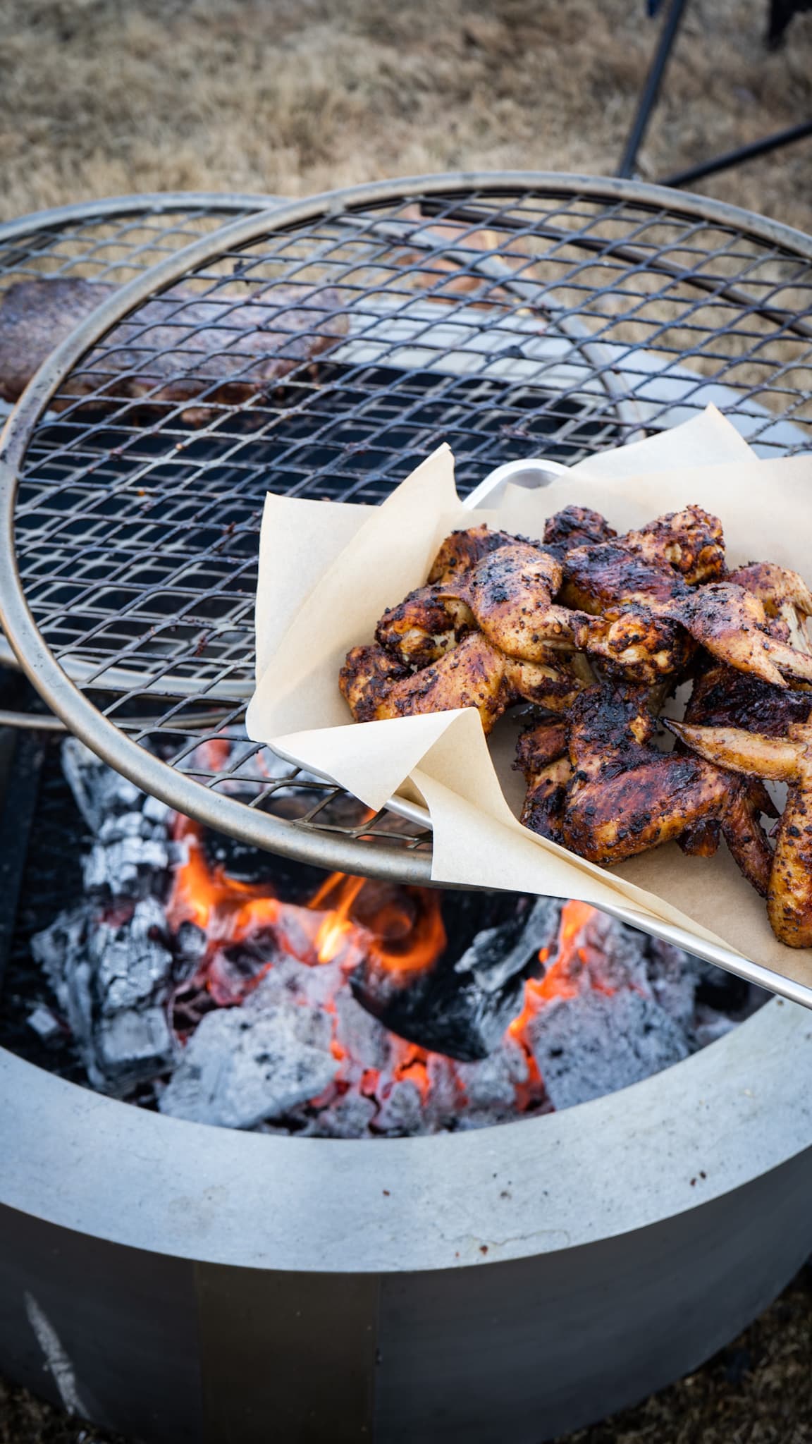 chicken wings on the grill with live fire