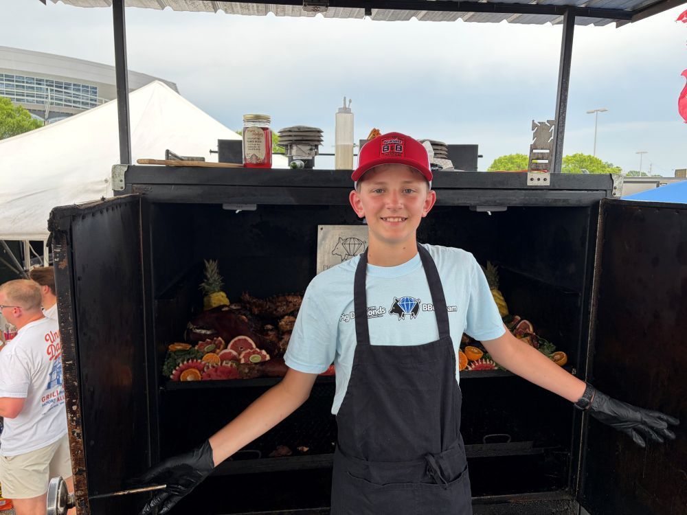 Team B&B future all star cole little of pig diamonds bbq, holding a large trophy 