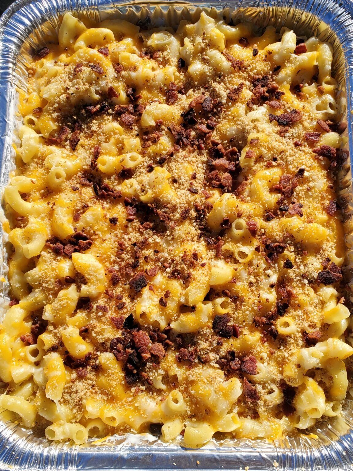 bird's eye view of smoked mac and cheese sprinkled with bacon