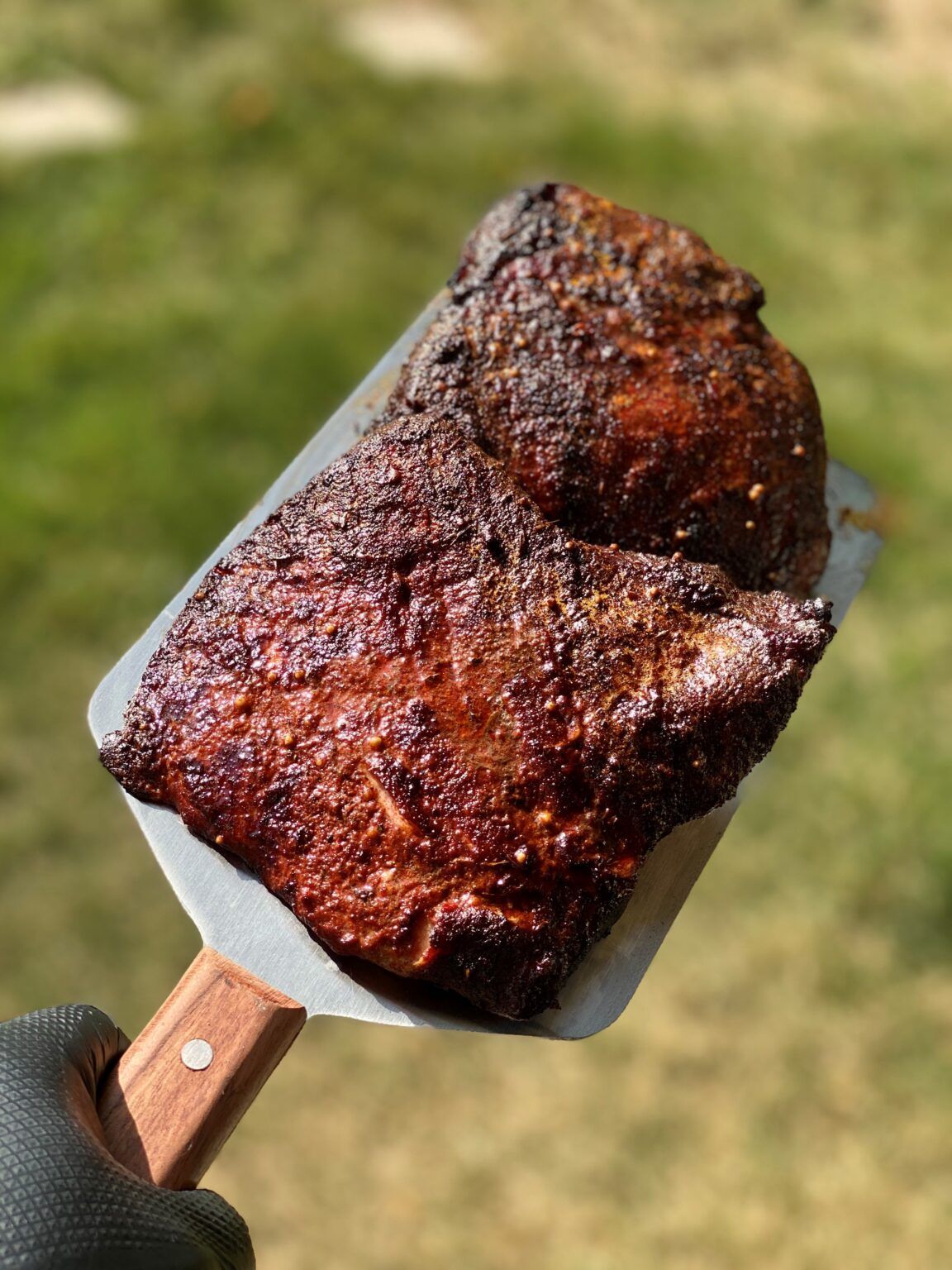 Closeup of a char-grilled piece of burnt end pork brisket