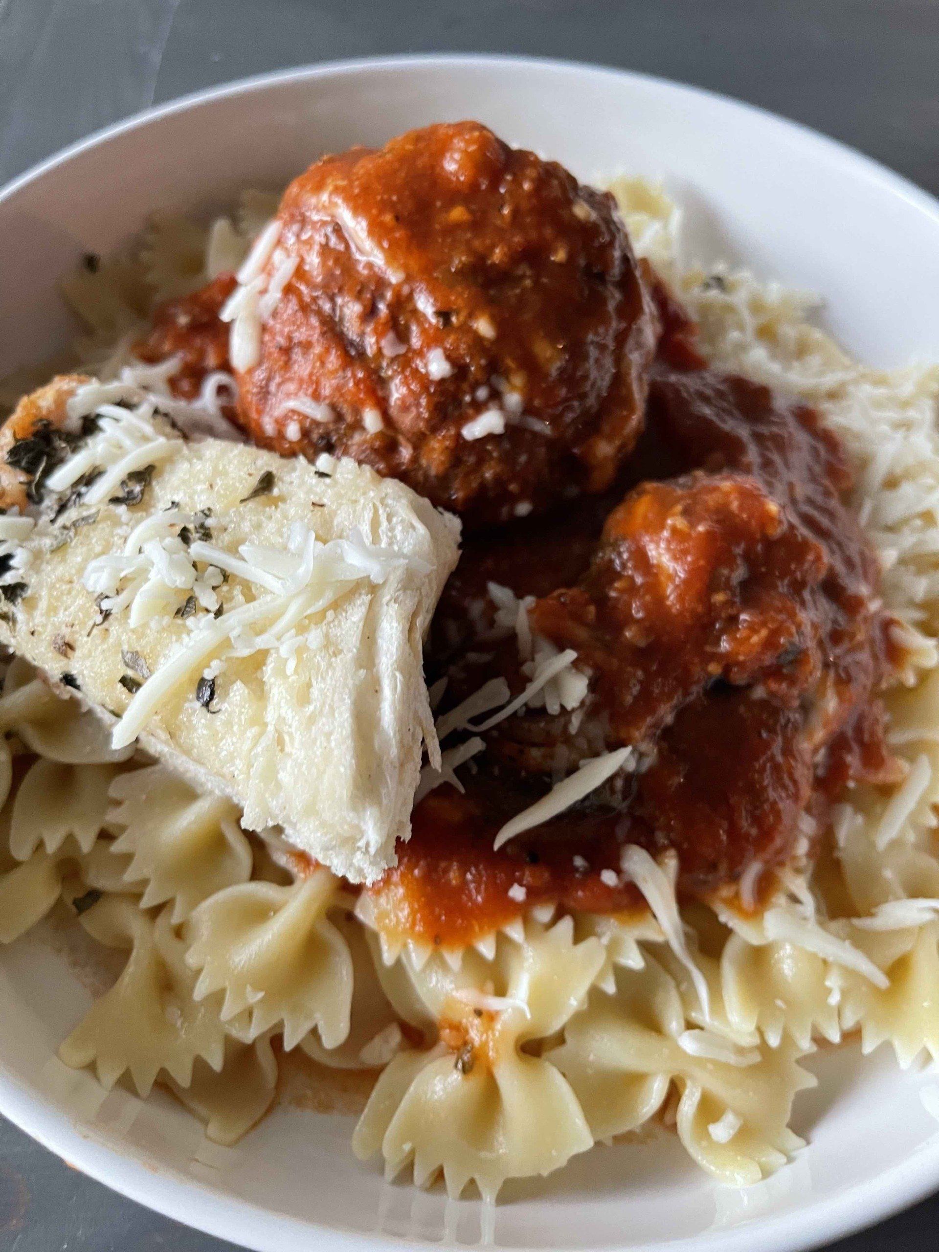Bowl of Pasta and grilled stuffed meatballs