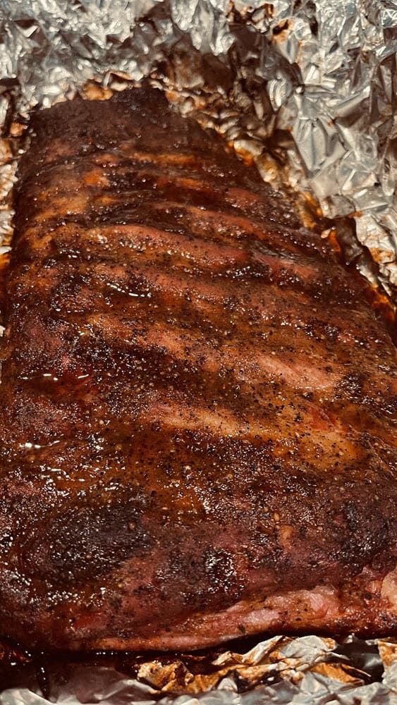 smoked and seasoned pork ribs in foil