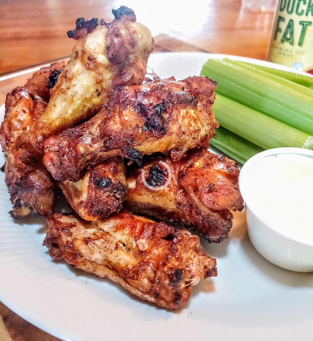 Grilled Chicken wings with celery and blue cheese dip