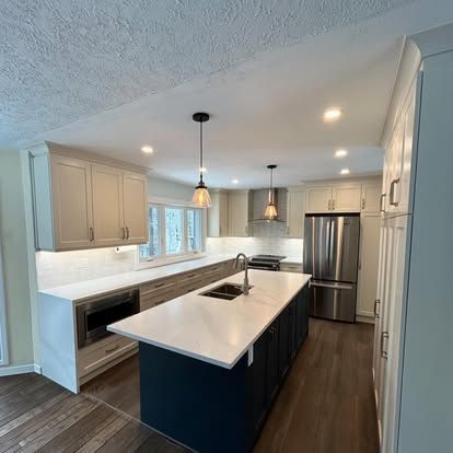 A man is standing on a ladder working on a wall