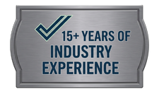 Silver badge with navy text and checkmark reading “15+ years of industry experience”