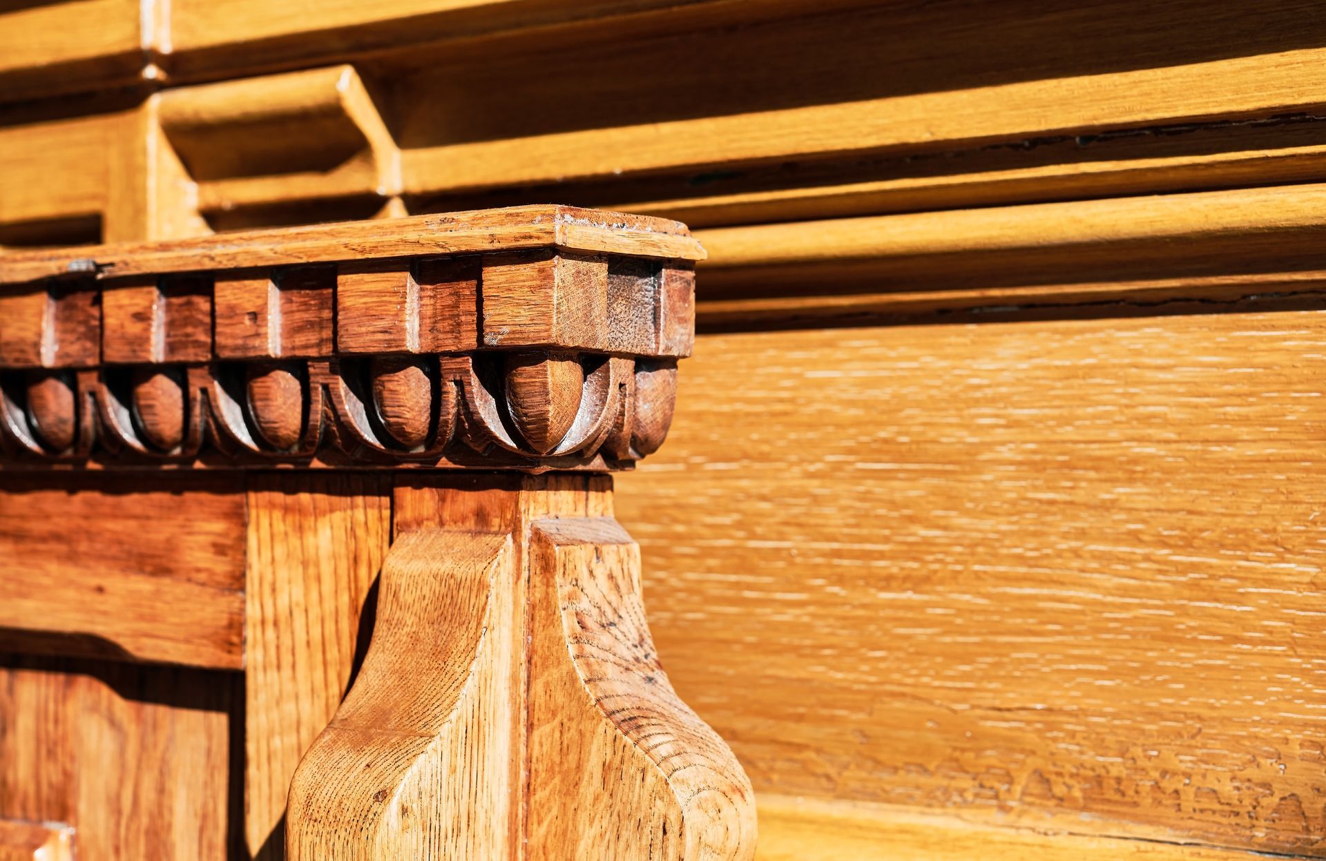 A close up of a piece of wood with a carving on it.