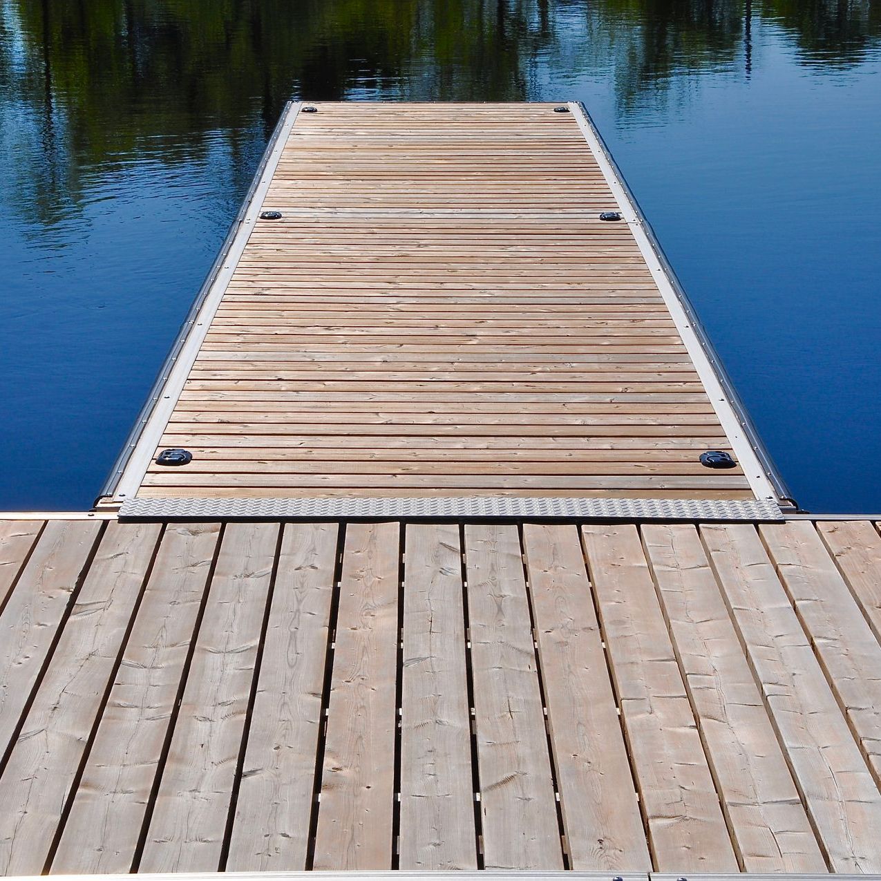 A wooden dock leading into a body of water