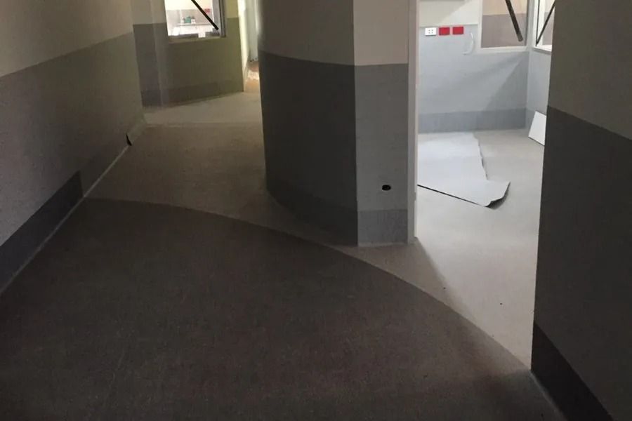 Interior Hallway With Grey and White Walls and Flooring — Ozwide Flooring In Ciccone, NT