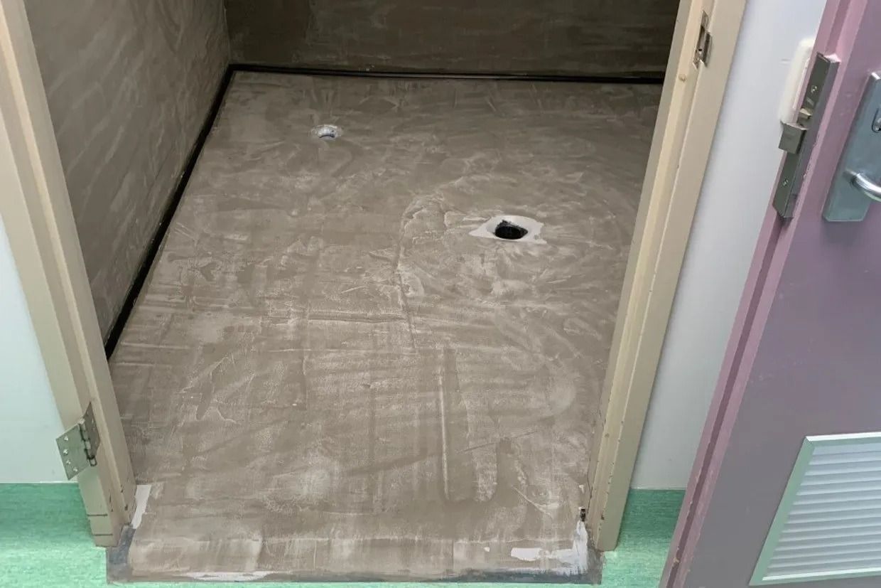 Doorway With Ramp Leading Into a Small, Empty Room With a Concrete Floor — Ozwide Flooring In Ciccone, NT