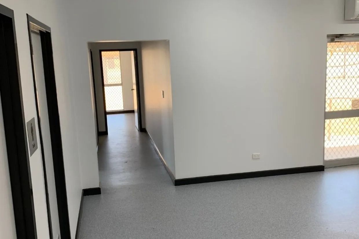 Interior View of a Room With White Walls, Black Trim, and Grey Flooring — Ozwide Flooring In Ciccone, NT
