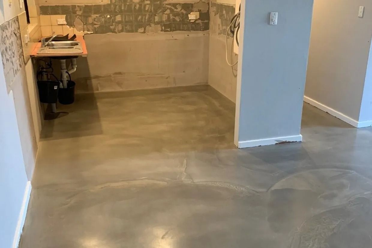 Grey Cement Floor in a Room With Partially Finished Walls — Ozwide Flooring In Ciccone, NT