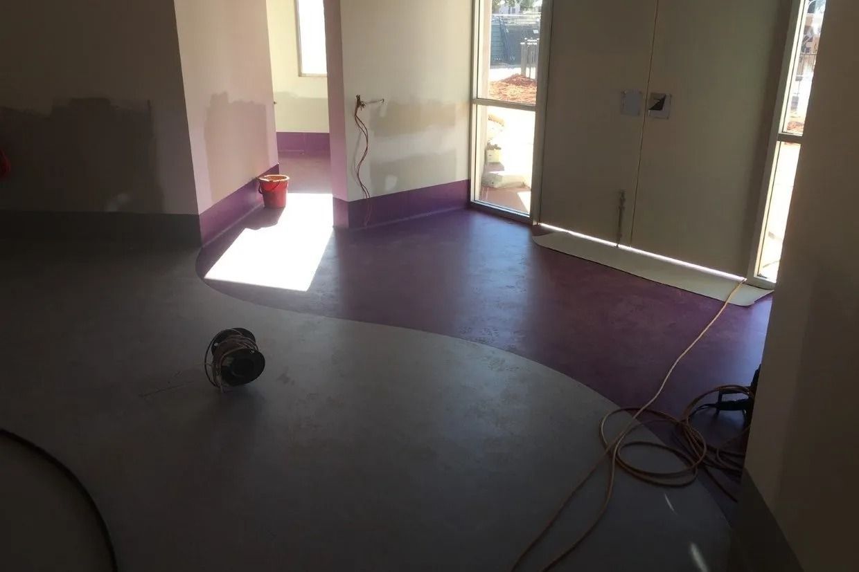 Interior View of a Room With Two-tone Flooring; Grey and Purple — Ozwide Flooring In Ciccone, NT