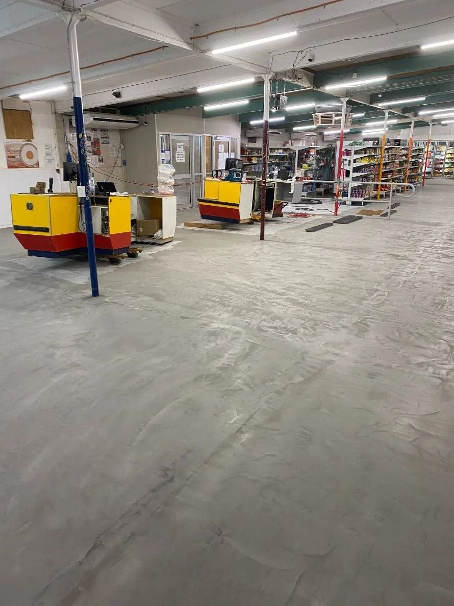Warehouse Interior With Two Yellow and Red Forklifts — Ozwide Flooring In Ciccone, NT