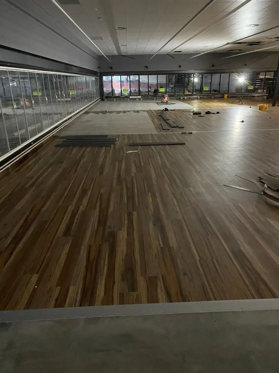 Gym Interior With Wood Flooring Installation Underway — Ozwide Flooring In Ciccone, NT