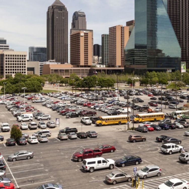 A lot of cars are parked in a parking lot