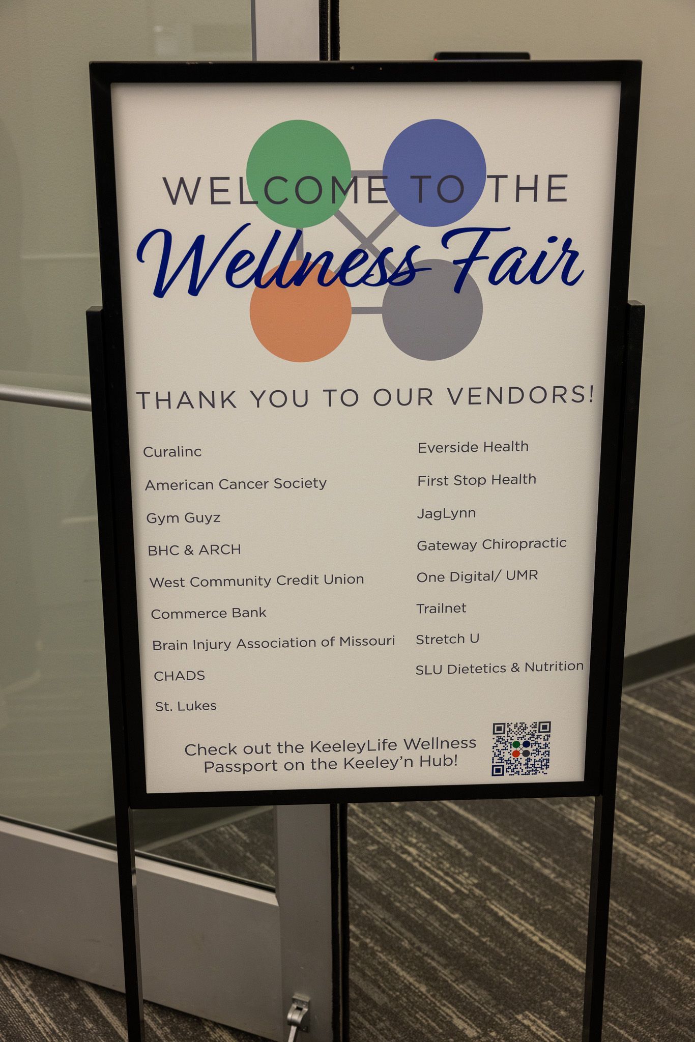 A sign that says welcome to the wellness fair on it