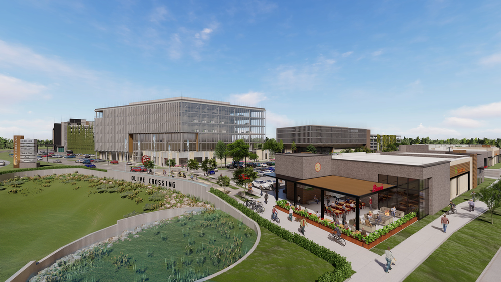 An aerial view of a large building with a lot of people walking around it.