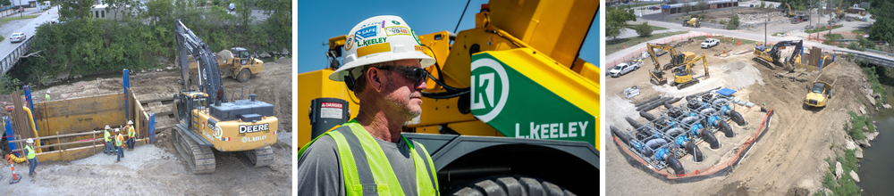 A man wearing a hard hat and safety vest is standing next to a crane.