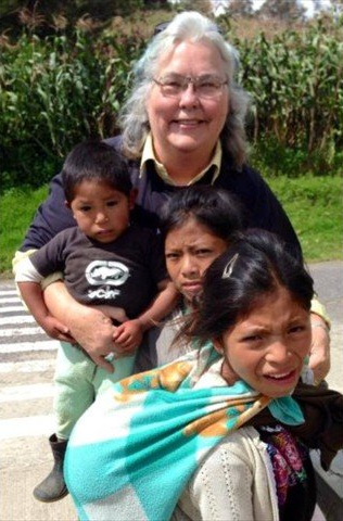 MY PRECIOUS MAYAN FRIENDS WHO CAME TO VISIT DOCTOR KATHIE NELSON @ WAY -BI GUATEMALA. THE CHILD IN FRONT OF THE PHOTO HAS A BABY WRAPPED AROUND HER NECK. CAN YOU ONLY IMAGINE YOUR CHILDREN BEING SO ATTENTIVE WITH THEIR SIBLINGS?