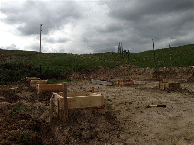 A construction site with a cloudy sky in the background at Pine Ridge Reservation