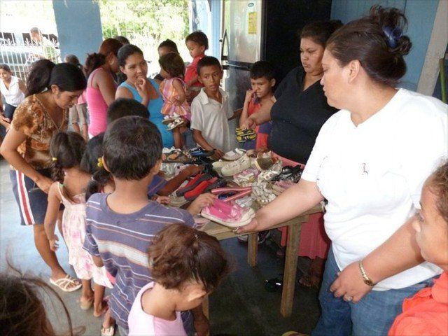 Your donation of children's shoes being distributed.