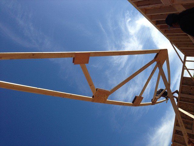 A wooden structure with a blue sky in the background at Pine Ridge Reservation