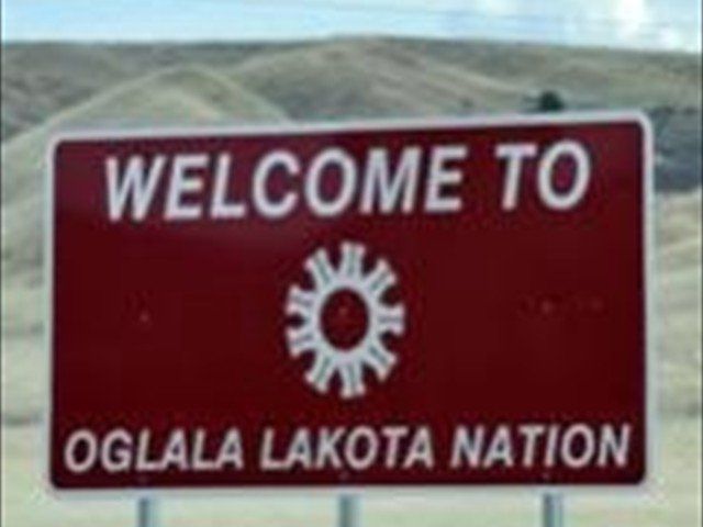 A sign that says welcome to oglala lakota nation