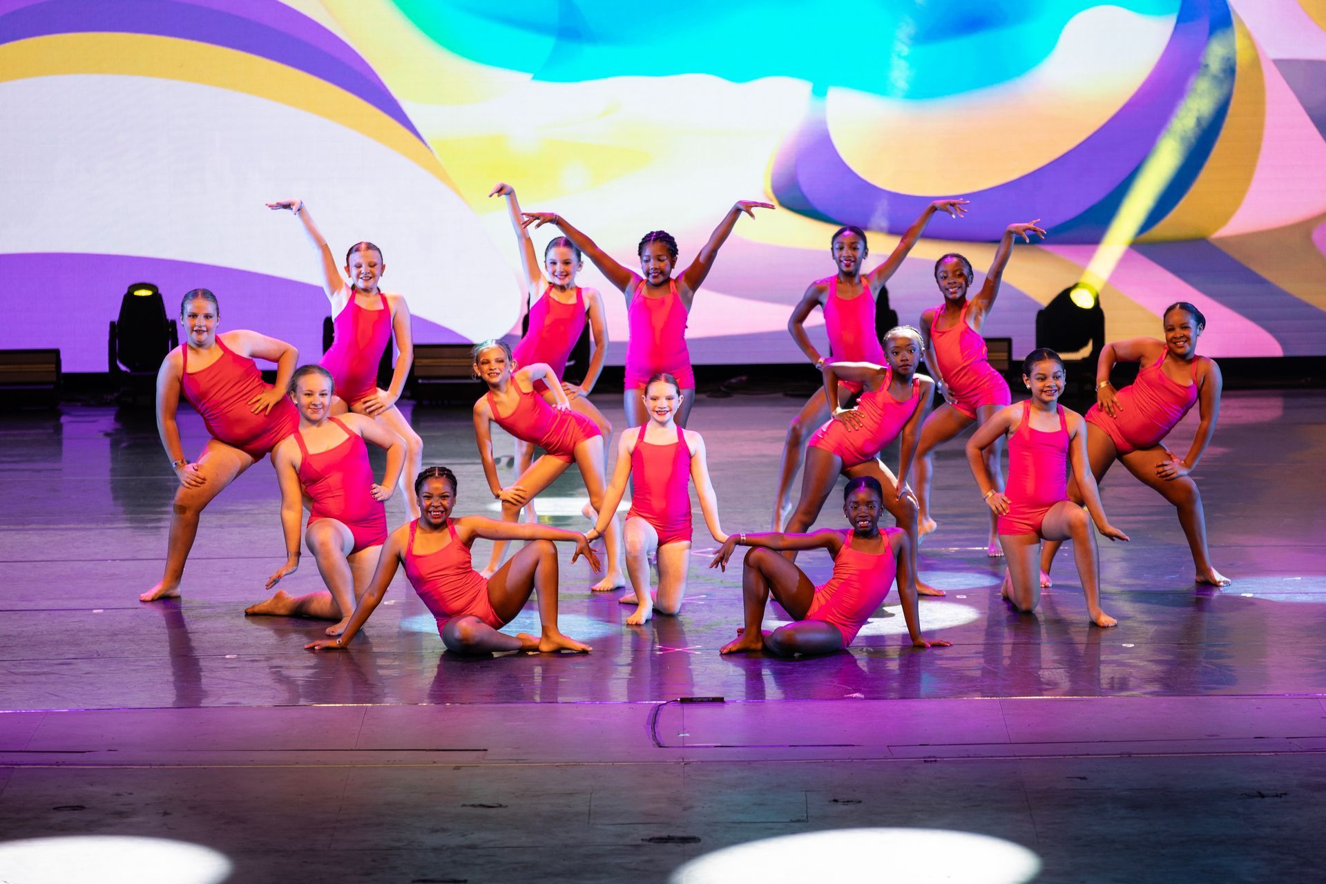 Dancers wearing pink leotards at the 2025 dance showcase