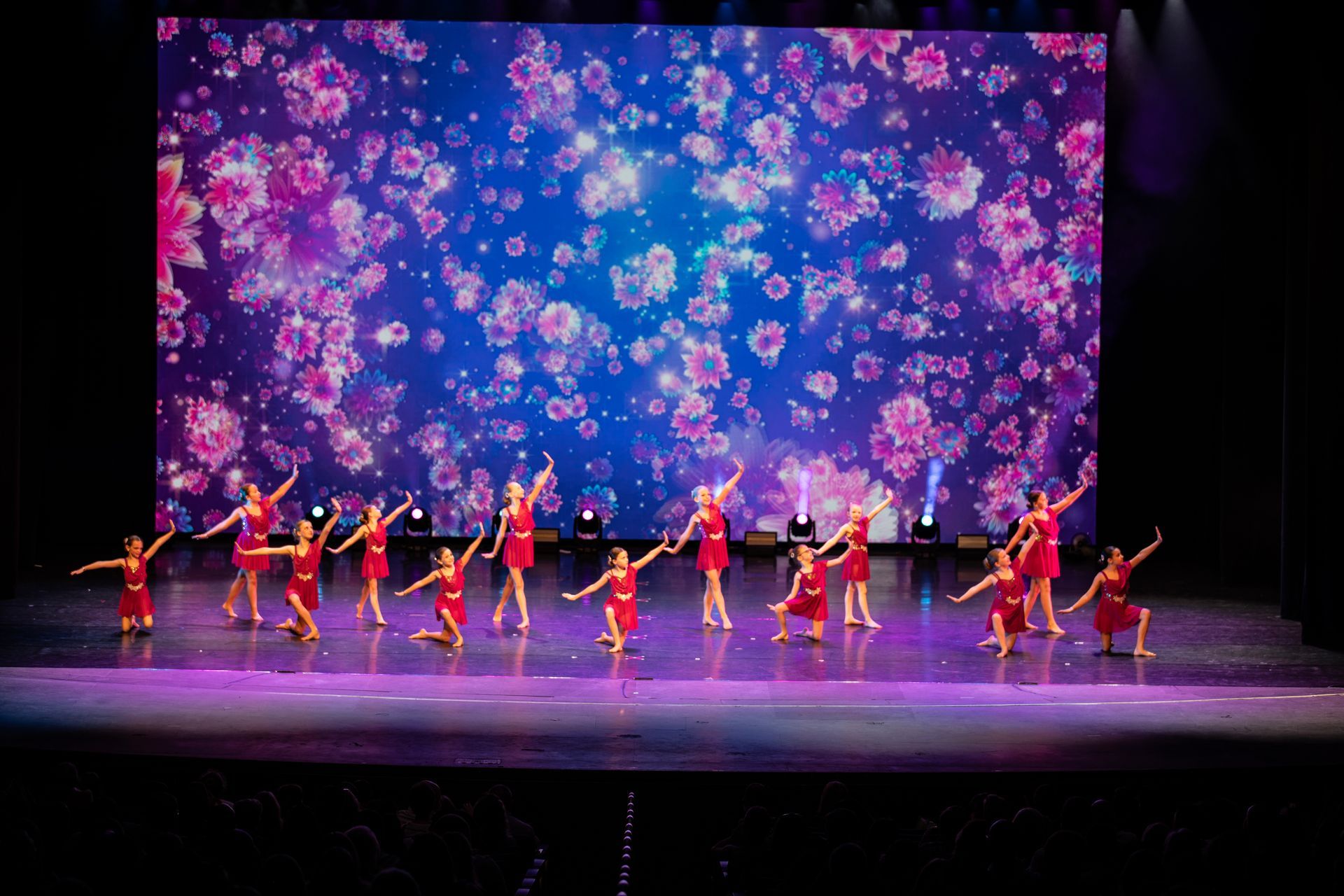 Dancers in red at the 2025 dance showcase