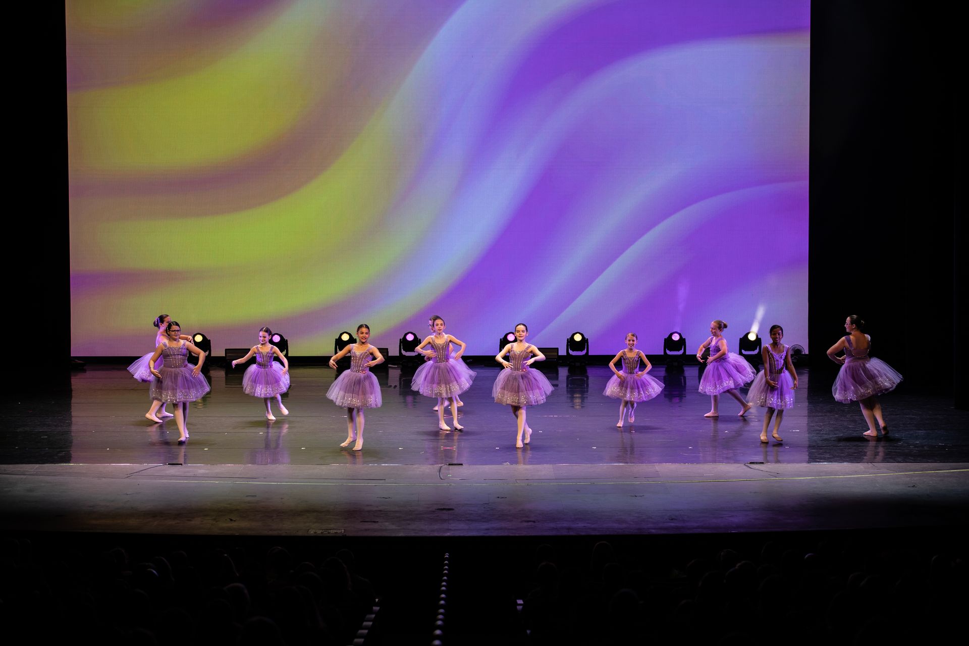 Ballet dancers in purple at the 2025 dance showcase