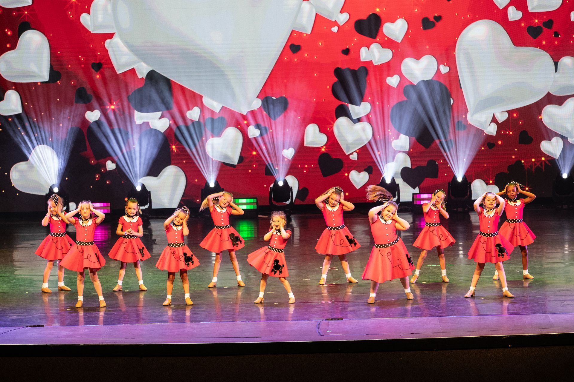 2025 dance showcase dancers wearing poodle skirts