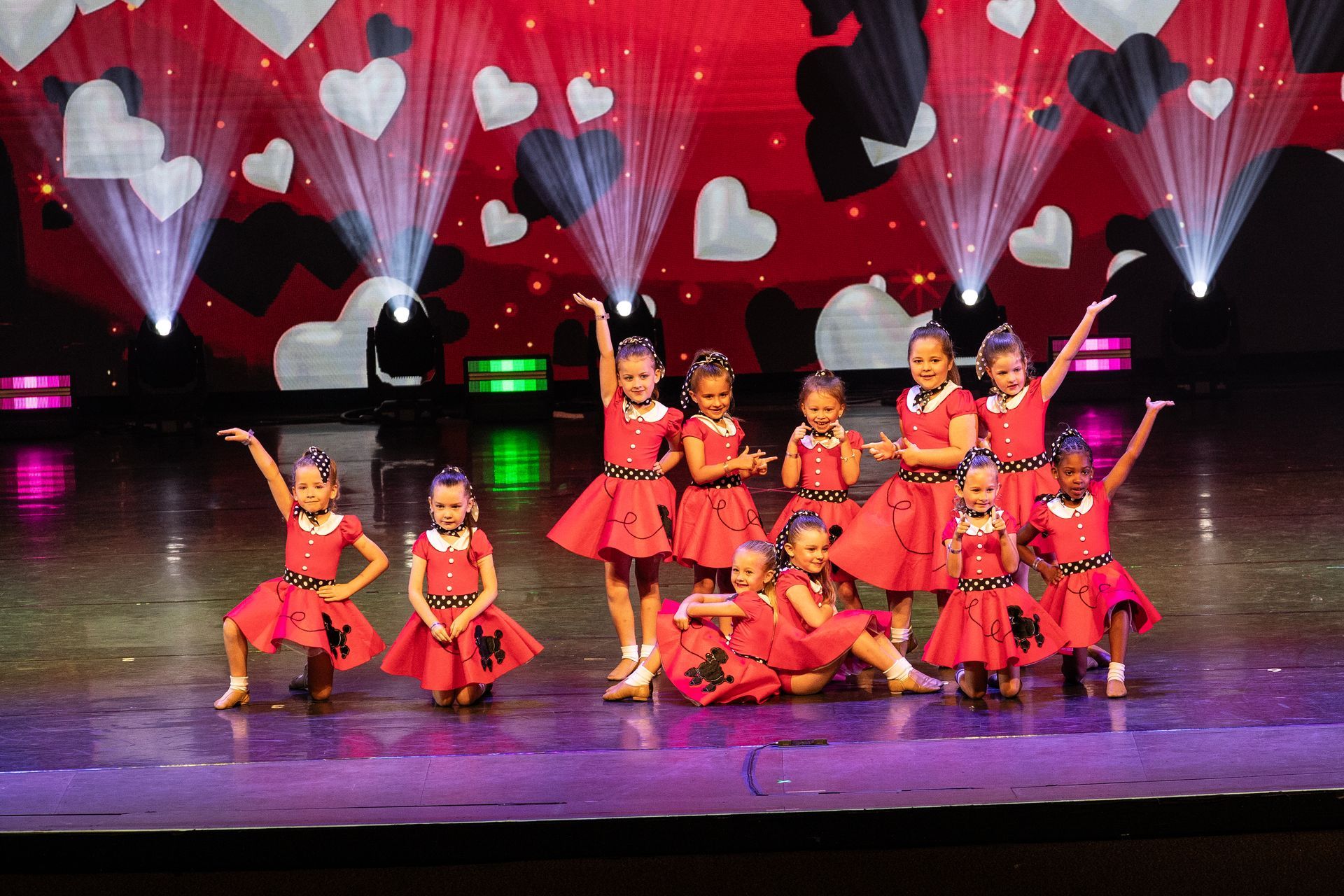 2025 dance showcase dancers in red poodle skirts