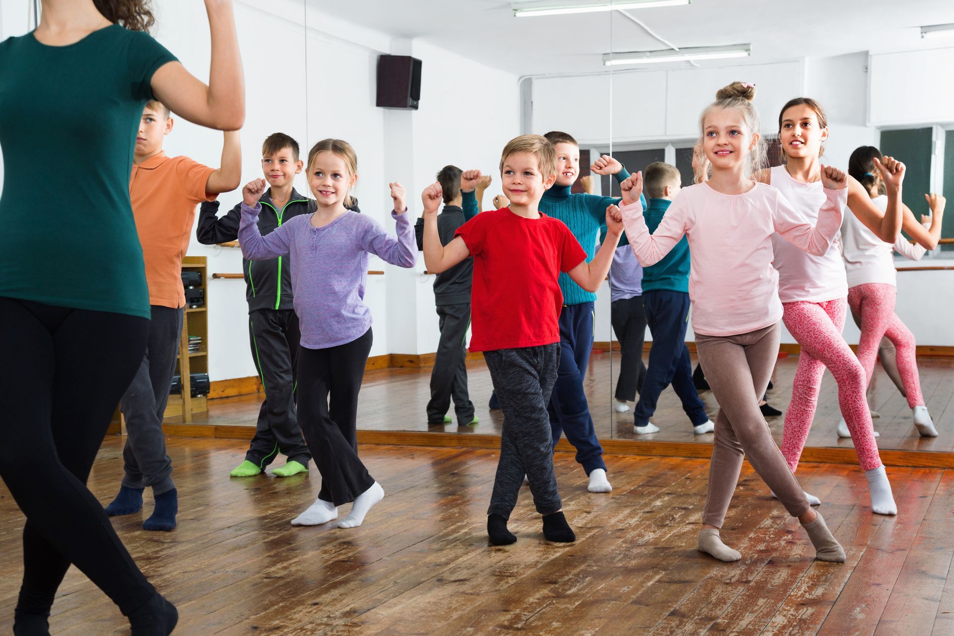 Children dancing contempt in studio smiling and having fun - Friendly children dancing contempt in s