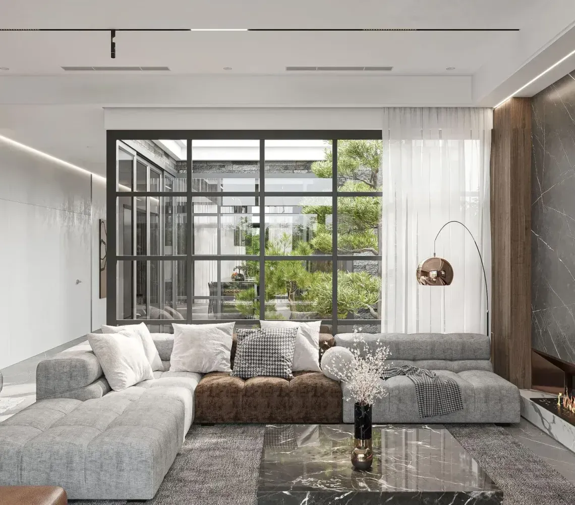 Modern living room with sectional sofa, marble coffee table, fireplace, and large window wall.