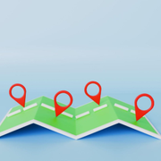 Folding map with four red location pins on a blue background
