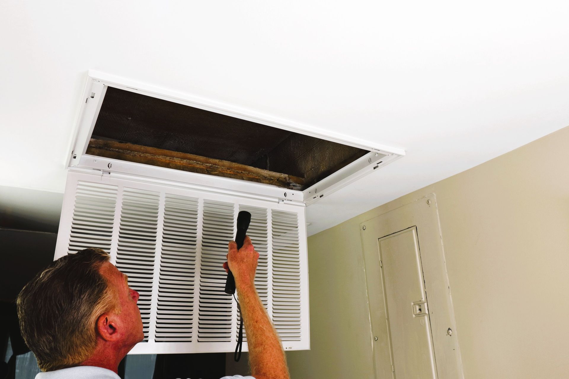 Professional duct sealing with foil insulation and tape to improve HVAC efficiency