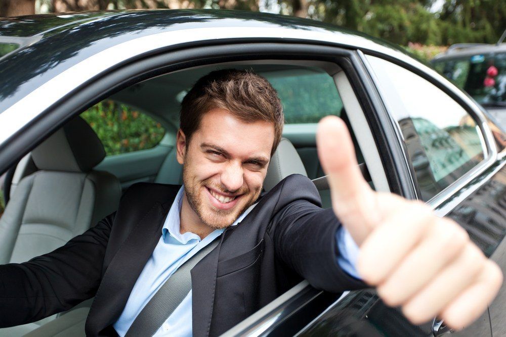 Man in car giving thumbs up | Eagle Transmission & Auto Repair
