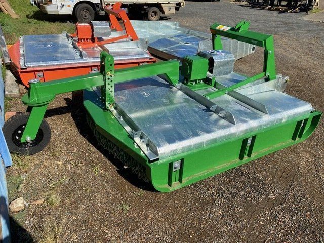 A Green and Silver Machine is Sitting on the Ground — Wingham Farm Machinery In Wingham, NSW