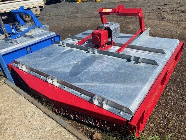 A Red and Silver Machine is Parked on the Side of the Road — Wingham Farm Machinery In Wingham, NSW