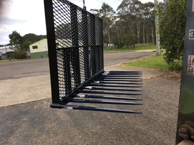 A Fence With a Bunch of Forks Attached to It — Wingham Farm Machinery in Wingham, NSW