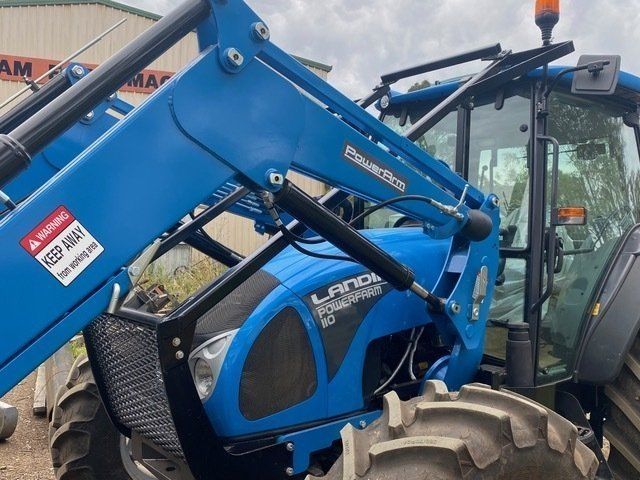 A Blue Tractor With a Keep Away Sticker on It — Wingham Farm Machinery in Wingham, NSW