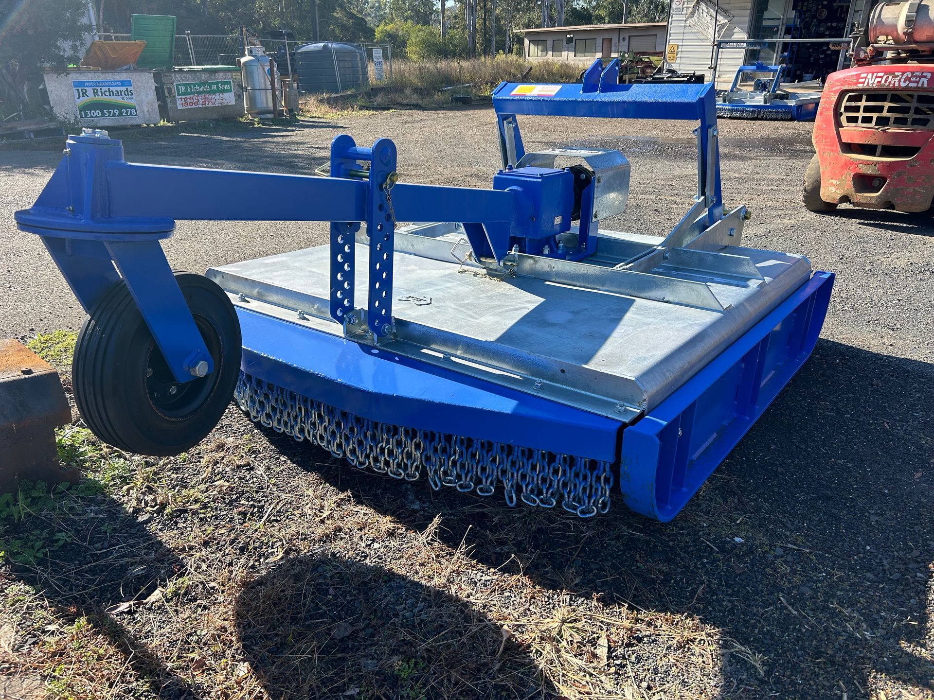Two Lawn Mowers Are Parked Next to Each Other in a Parking Lot — Wingham Farm Machinery in Wingham, NSW
