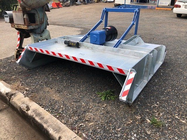 A Lawn Mower is Parked on the Side of the Road — Wingham Farm Machinery In Wingham, NSW