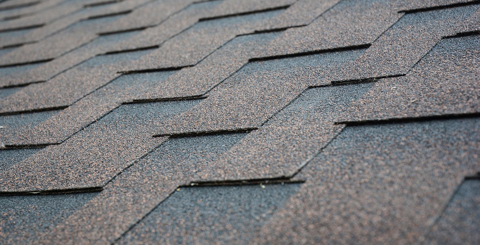 A close up of a roof with shingles on it.