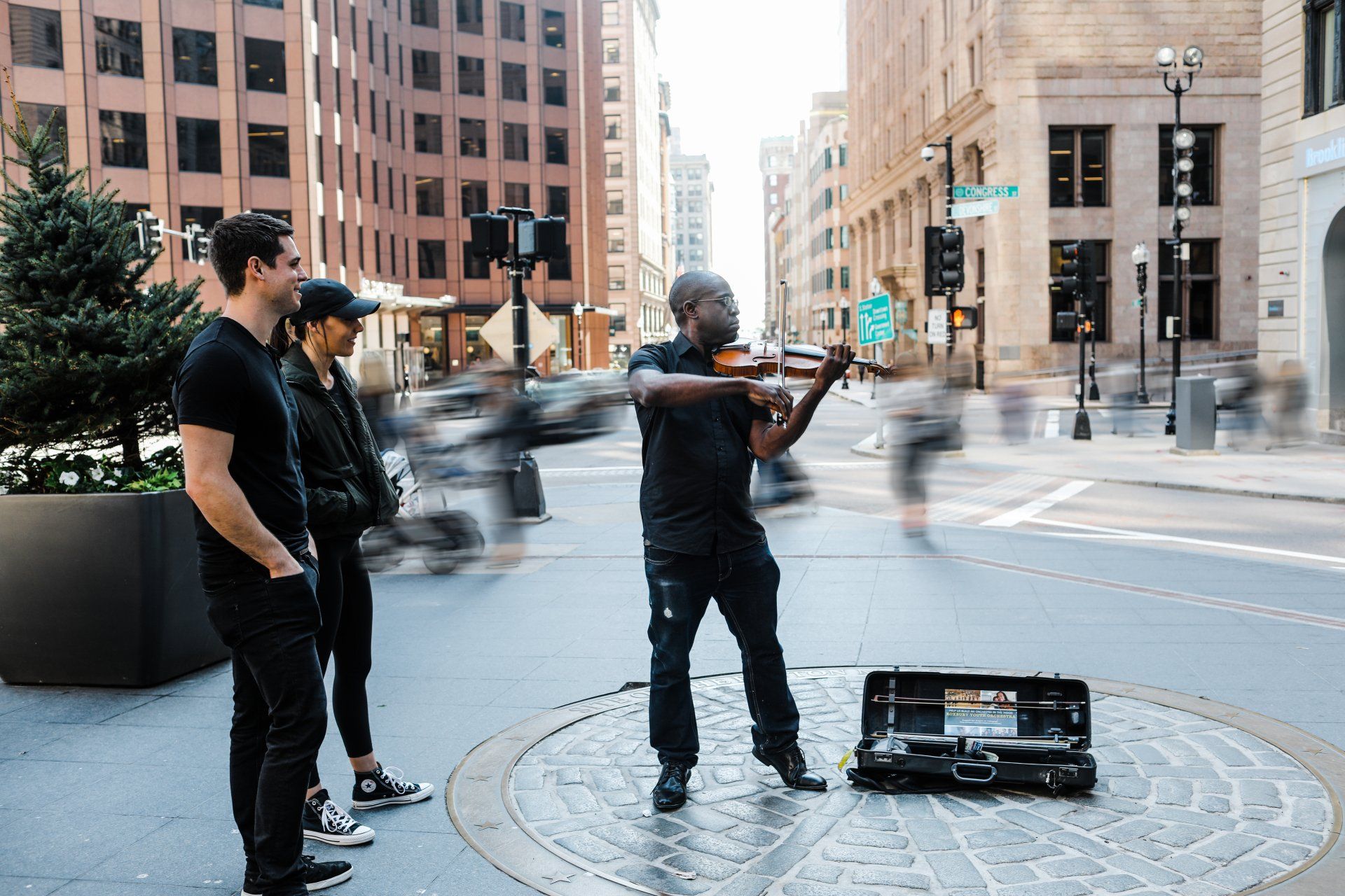David France playing his violin in the street