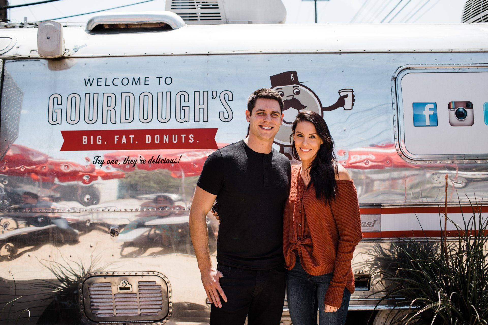 Brandon T. Adams and Samantha Rossin outside of Gourdough's