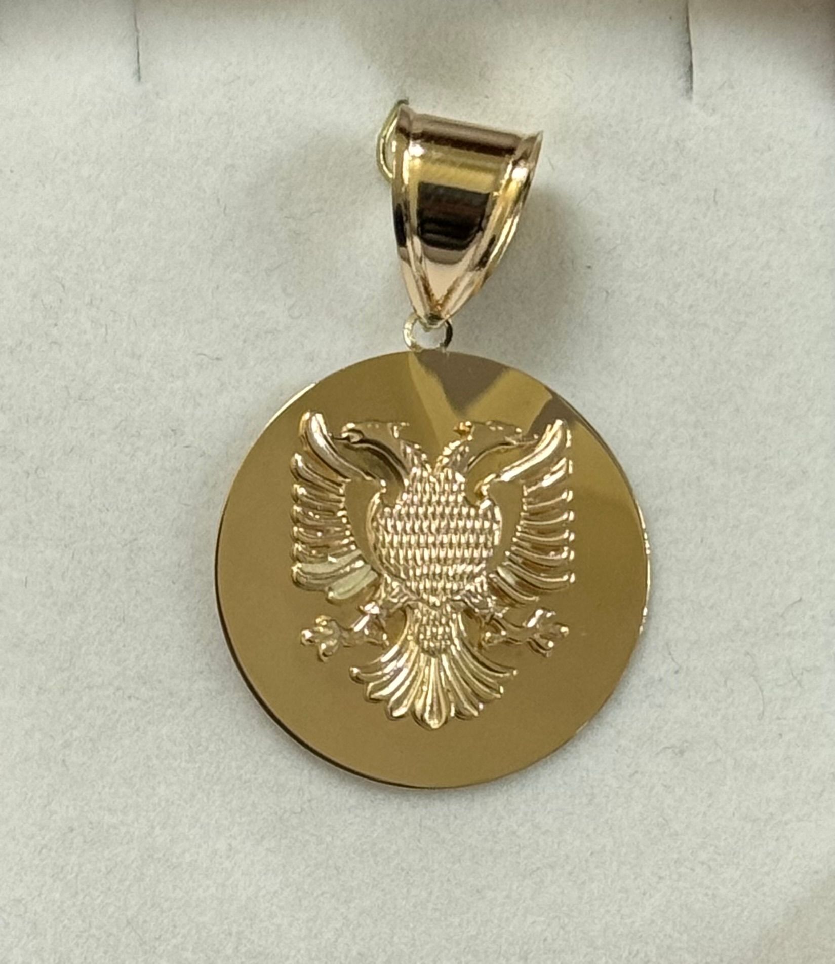 A gold coin with an eagle on it