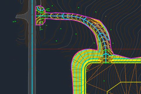 CAD drawing of infrastructure layout, including a roadway, drainage pipes, and contour lines, with a black background.