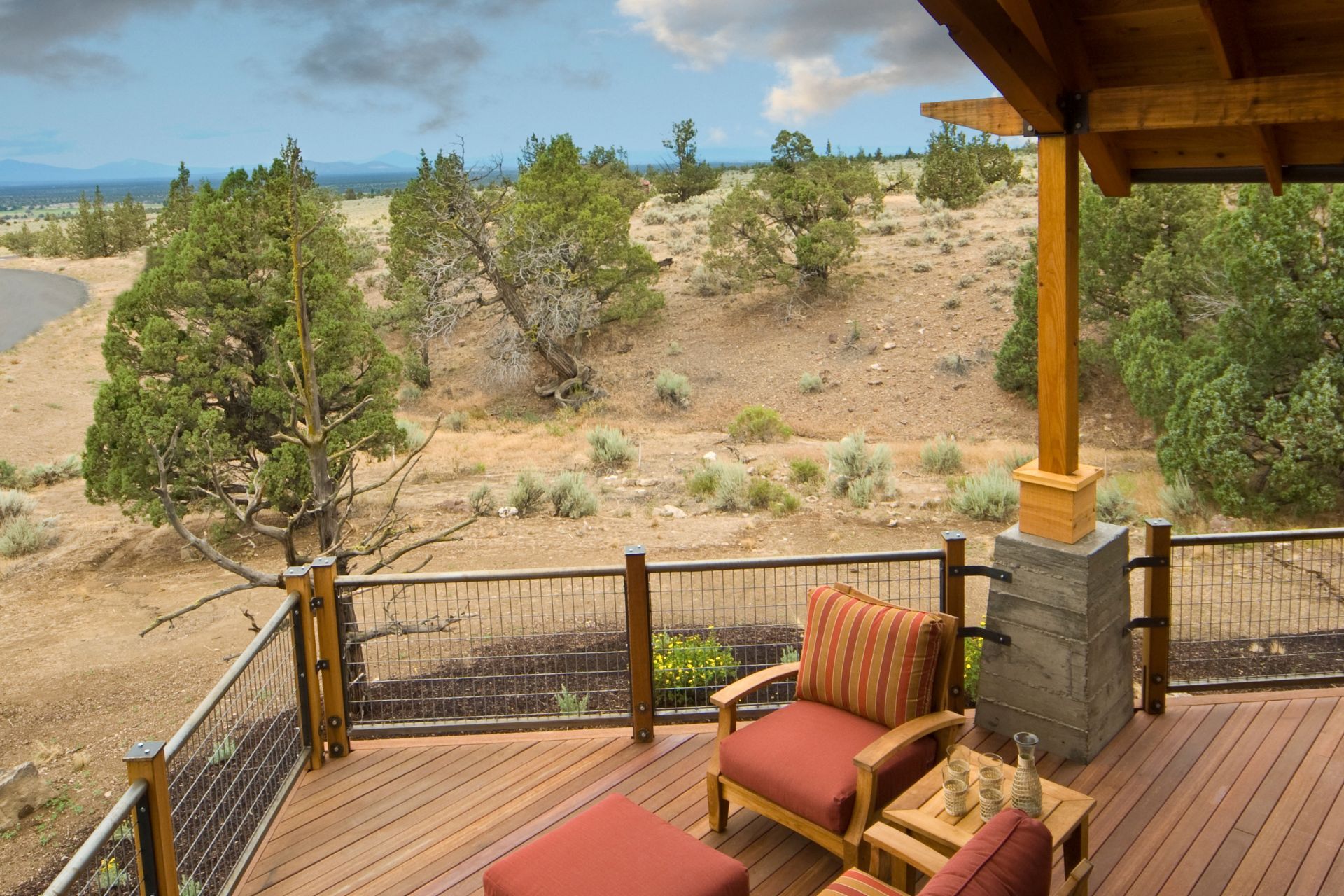 Wooden deck with red chairs overlooking a desert vista in Gilbert, AZ.